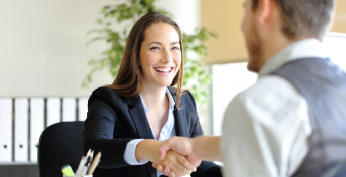 Businesspeople handshaking after deal or interview
